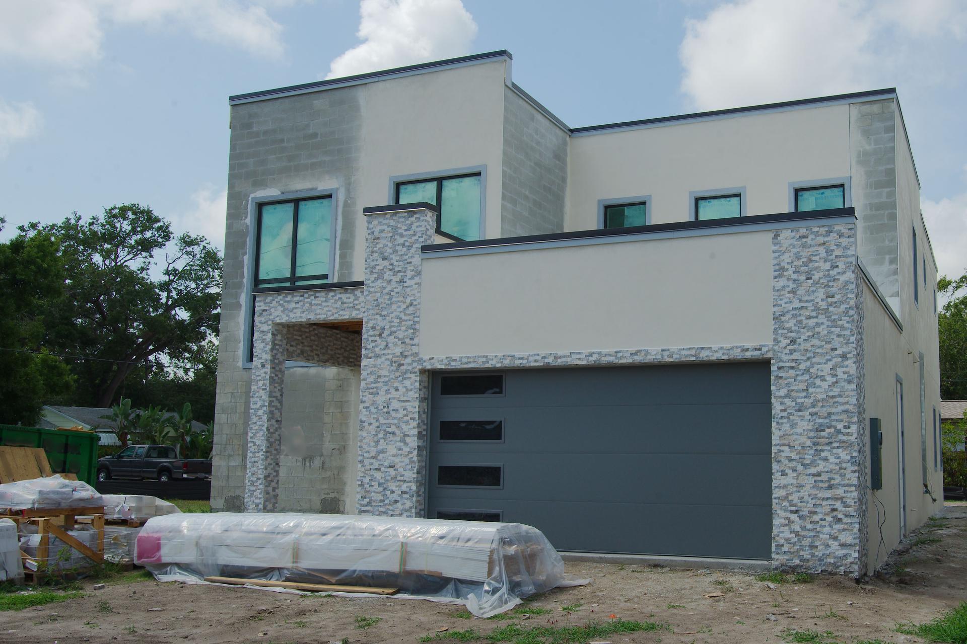 Two-Story House Under Construction with Open Framework in Florida.
